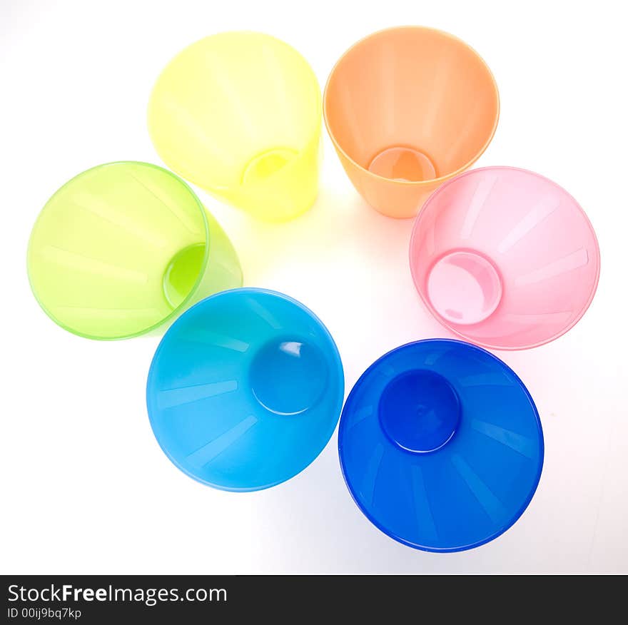 Colourfull plastic cups, bright and cheery.