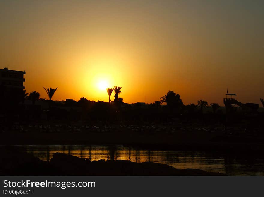 A photo of colourful sunrise\sunset on the beach. A photo of colourful sunrise\sunset on the beach