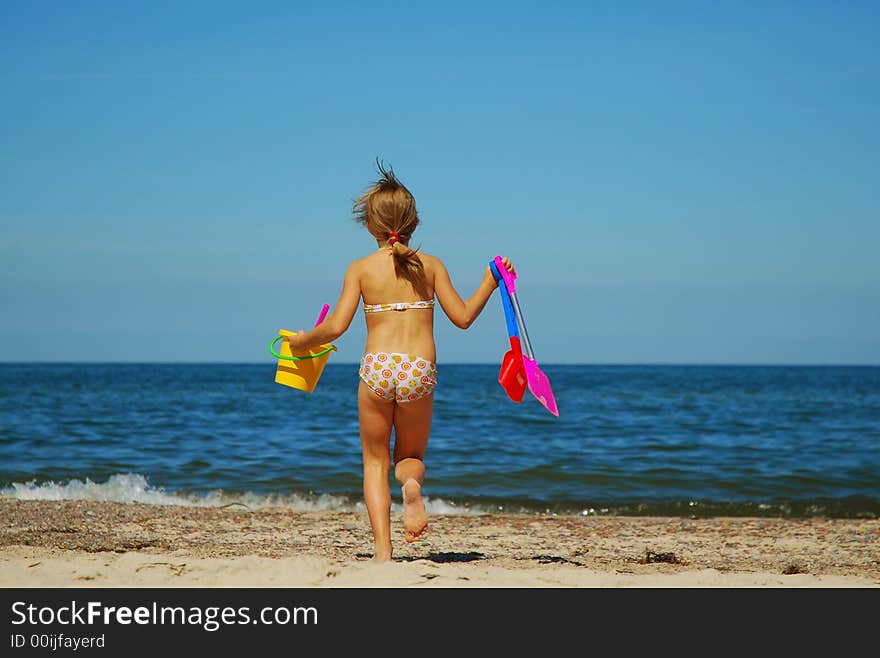 Girl playing on a beach