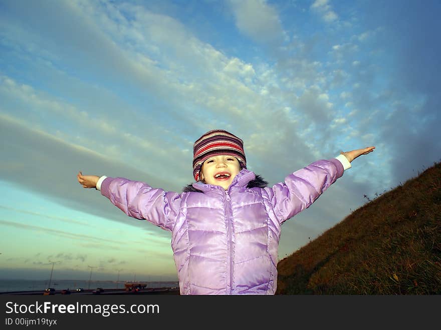 Autumn girl against blue sky. Autumn girl against blue sky