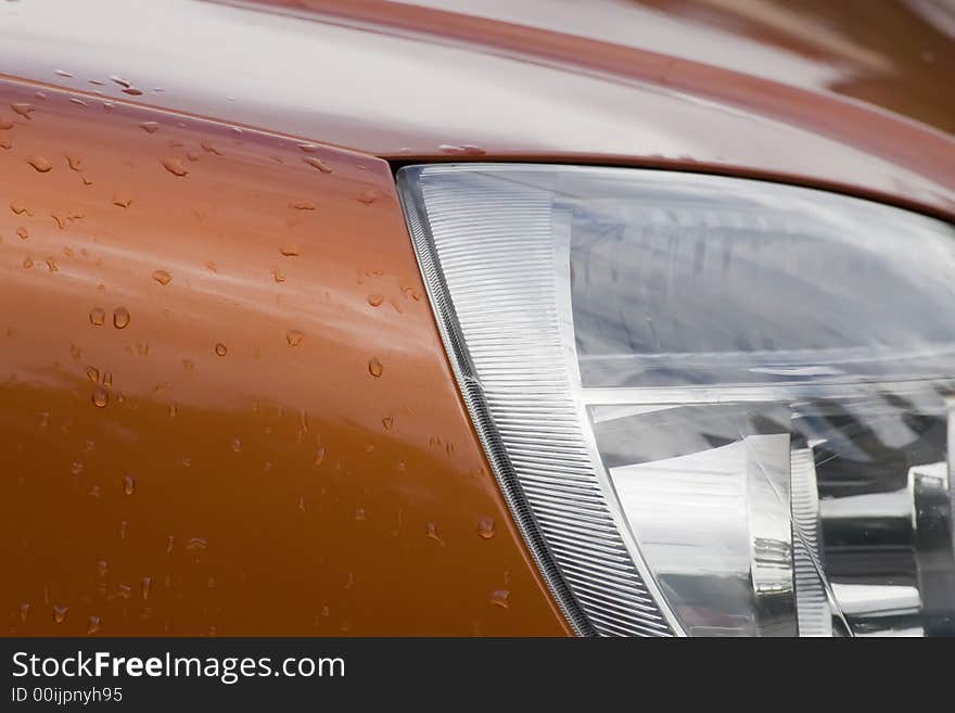 Water drops on red car surface. Water drops on red car surface.