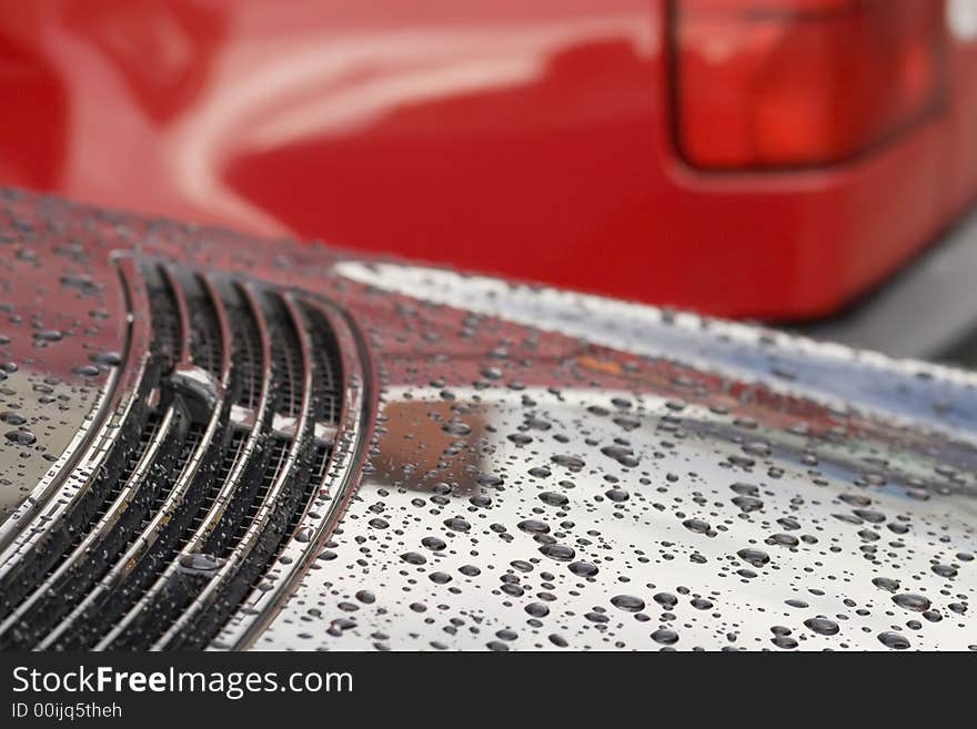 Water drops on black car surface. Water drops on black car surface.