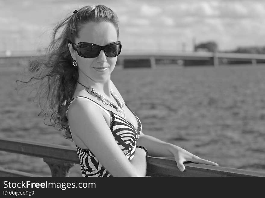 Beautiful young girl with sunglasses in the city. Beautiful young girl with sunglasses in the city