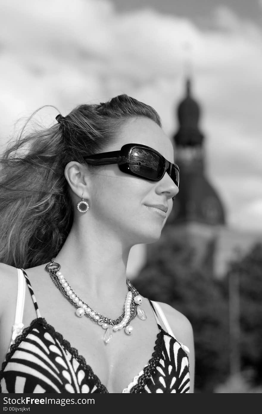 Beautiful young girl with sunglasses in the city. Beautiful young girl with sunglasses in the city