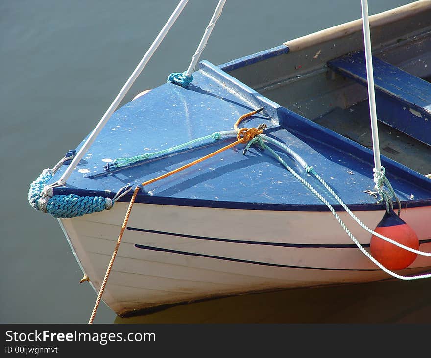 Small boat in harbor water. Small boat in harbor water