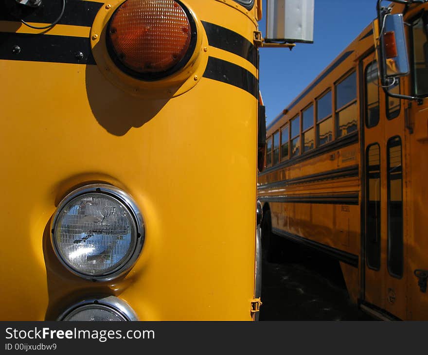 Details of school bus with headlight and orange turn signal. Details of school bus with headlight and orange turn signal