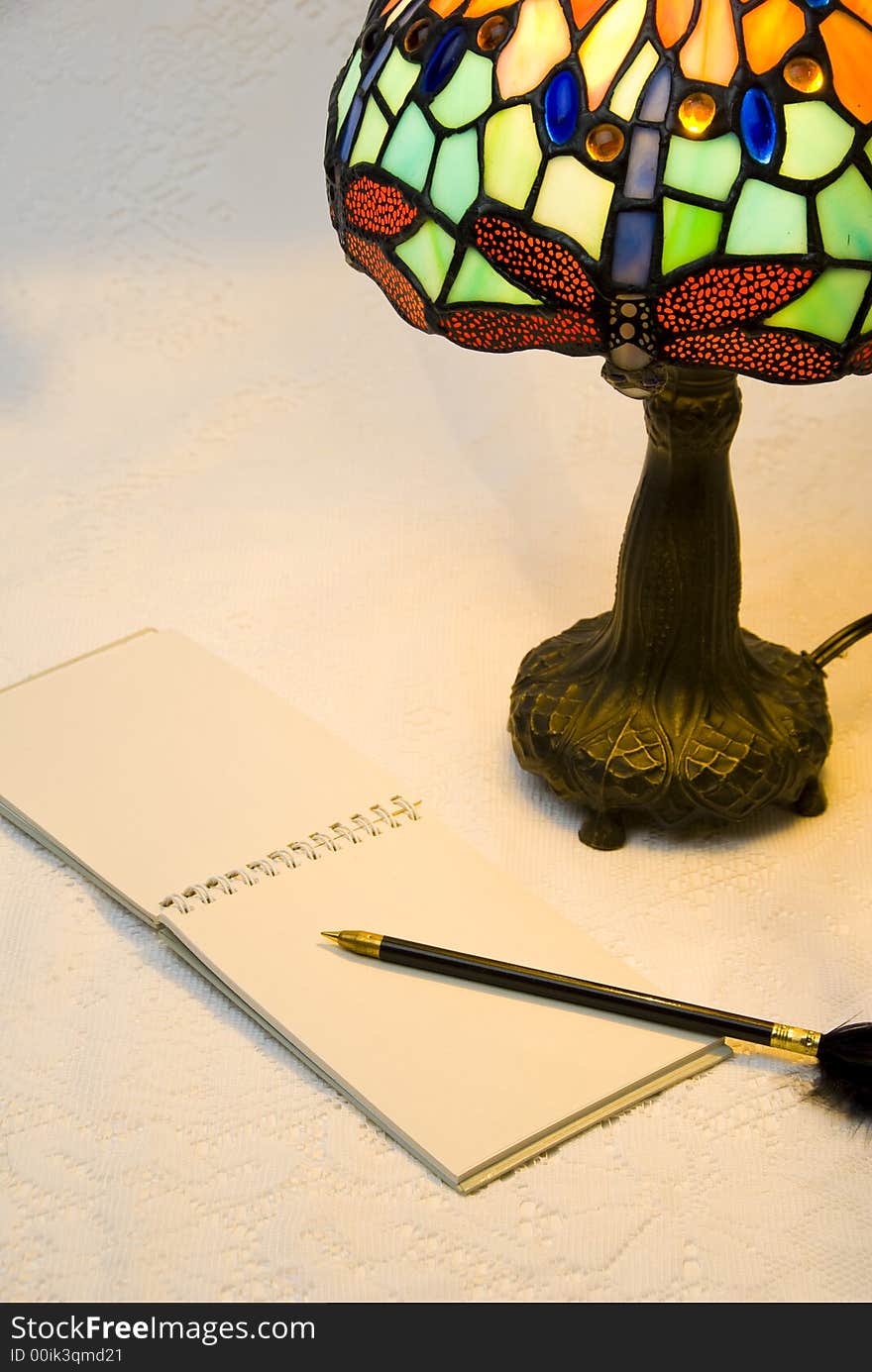 Closeup of lamp and notepad