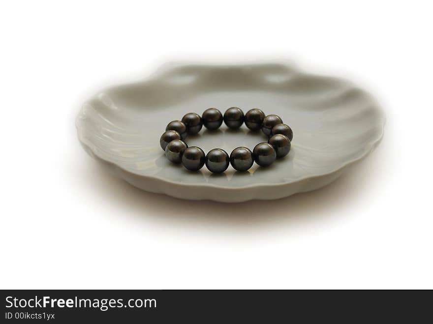 Black pearls in the white shell plate