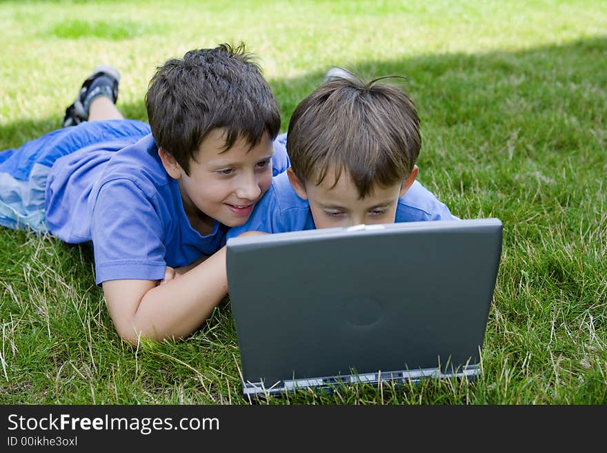 Two Cute Boy Study On Computer