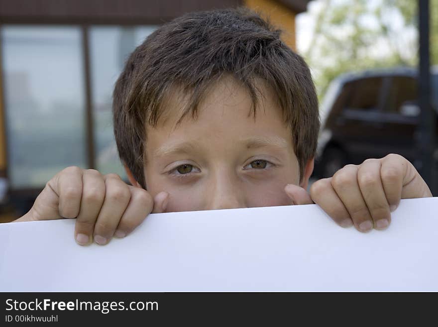 Boy Keeps Sheet Of Paper