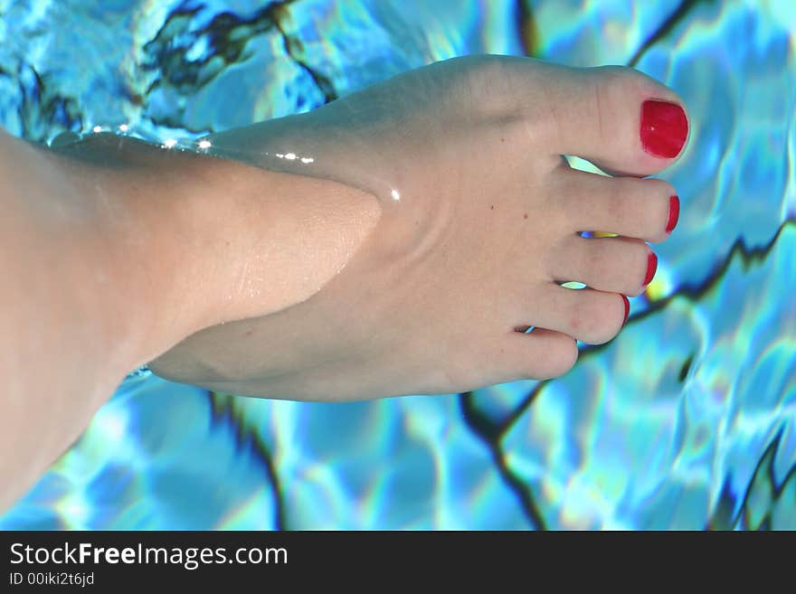 Foot in the swimming pool