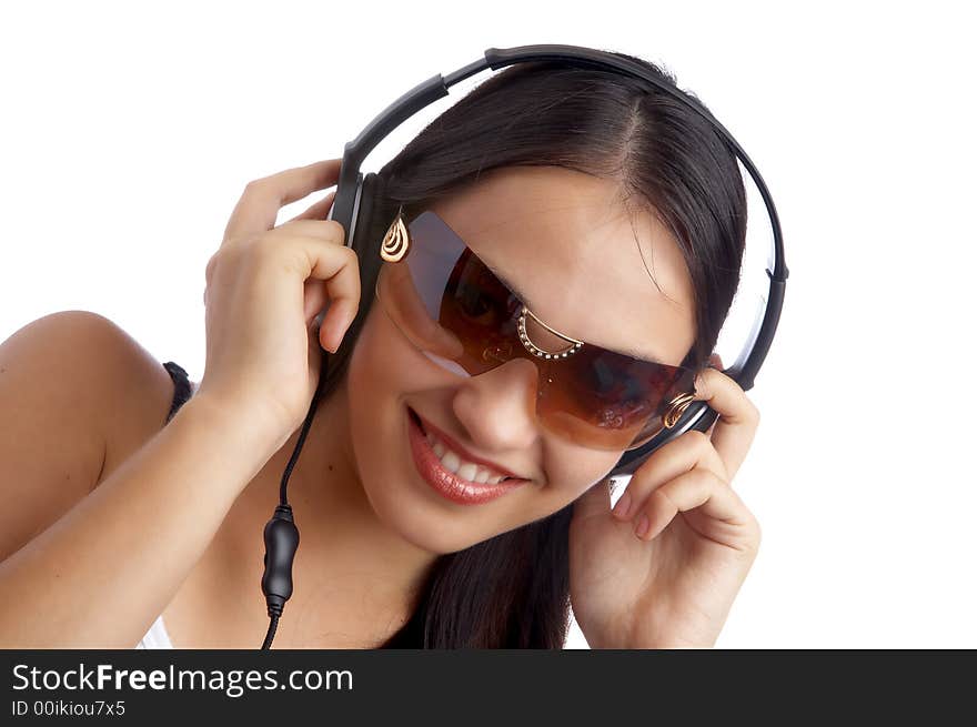 Young beautiful happy women listening music in headphones. Young beautiful happy women listening music in headphones