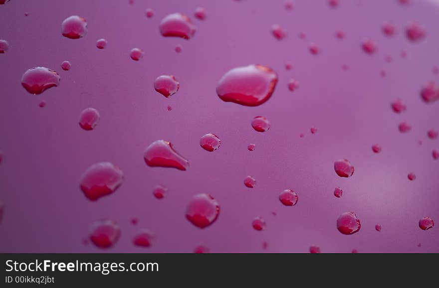 Water rain droplets on red glass background drop. Water rain droplets on red glass background drop