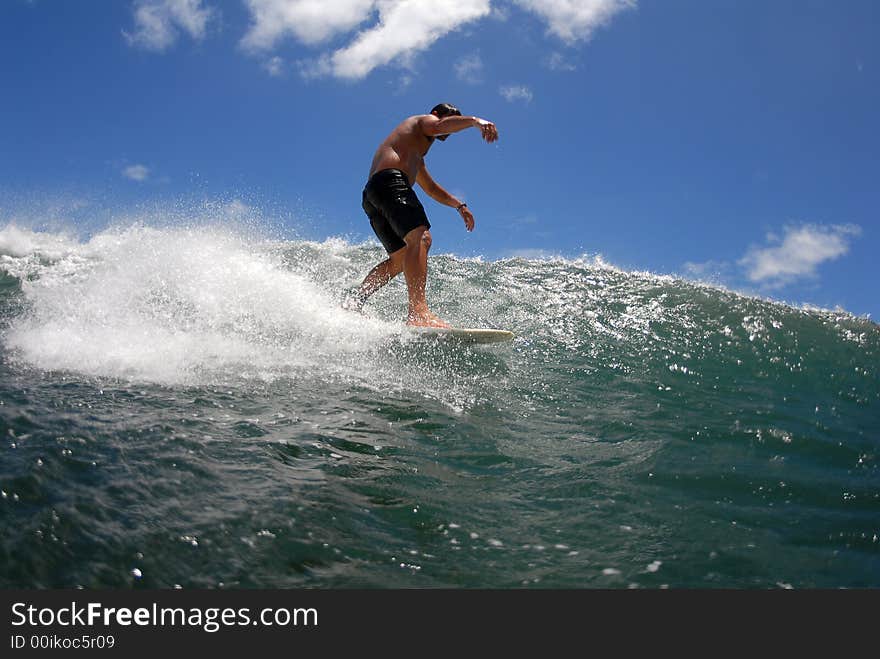 A longboarder walking on his board. A longboarder walking on his board