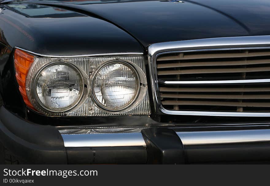 Grill and headlights on a classic luxury automobile. Grill and headlights on a classic luxury automobile