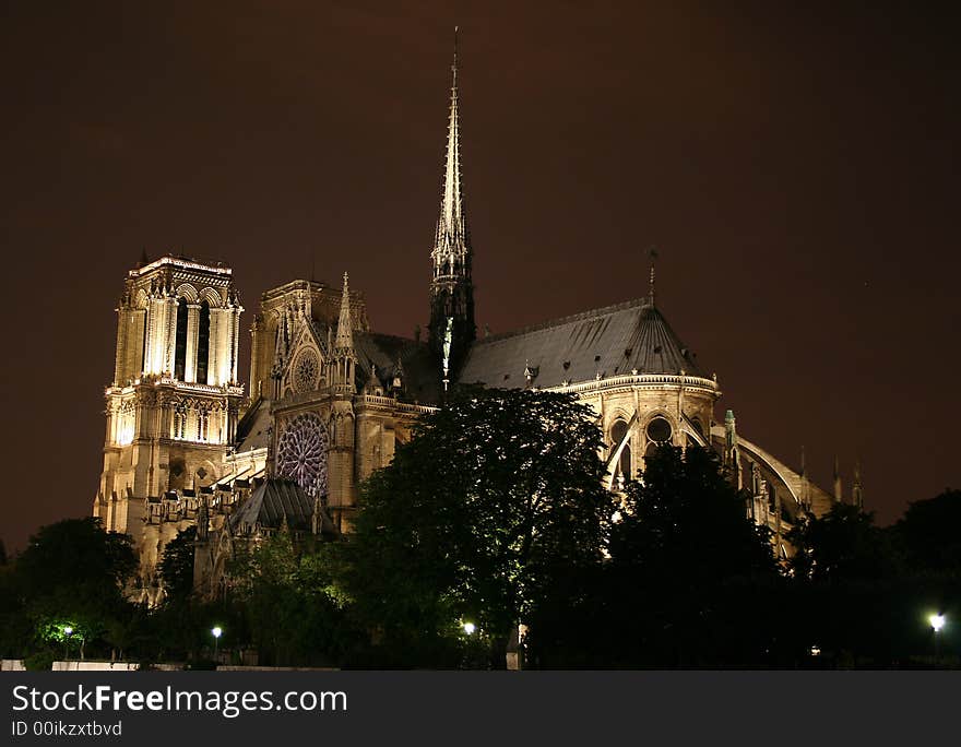 Photograph of the famous cathedral of Notre Dame in Paris, France, by night. Photograph of the famous cathedral of Notre Dame in Paris, France, by night.