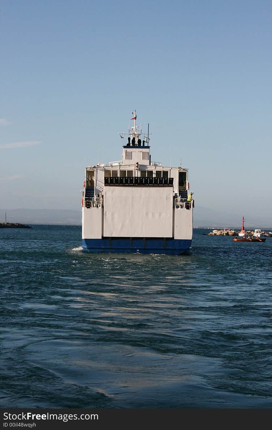 A transport ship leaving the harbour