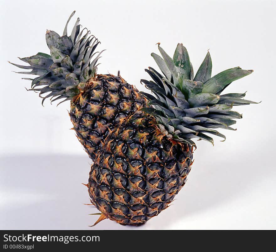 Delicious pineapples on white background. Delicious pineapples on white background