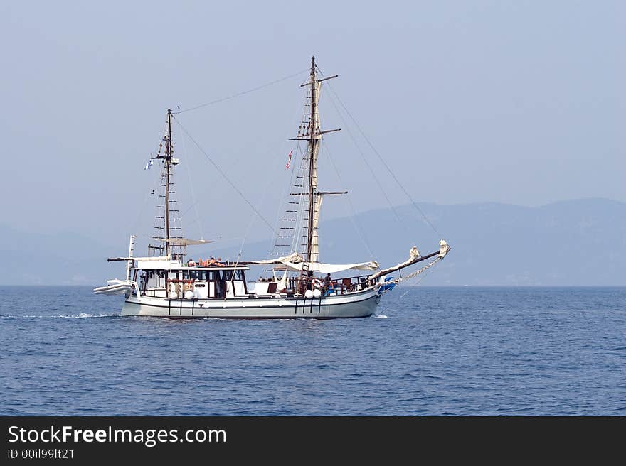 People sailing with an old style boat. People sailing with an old style boat