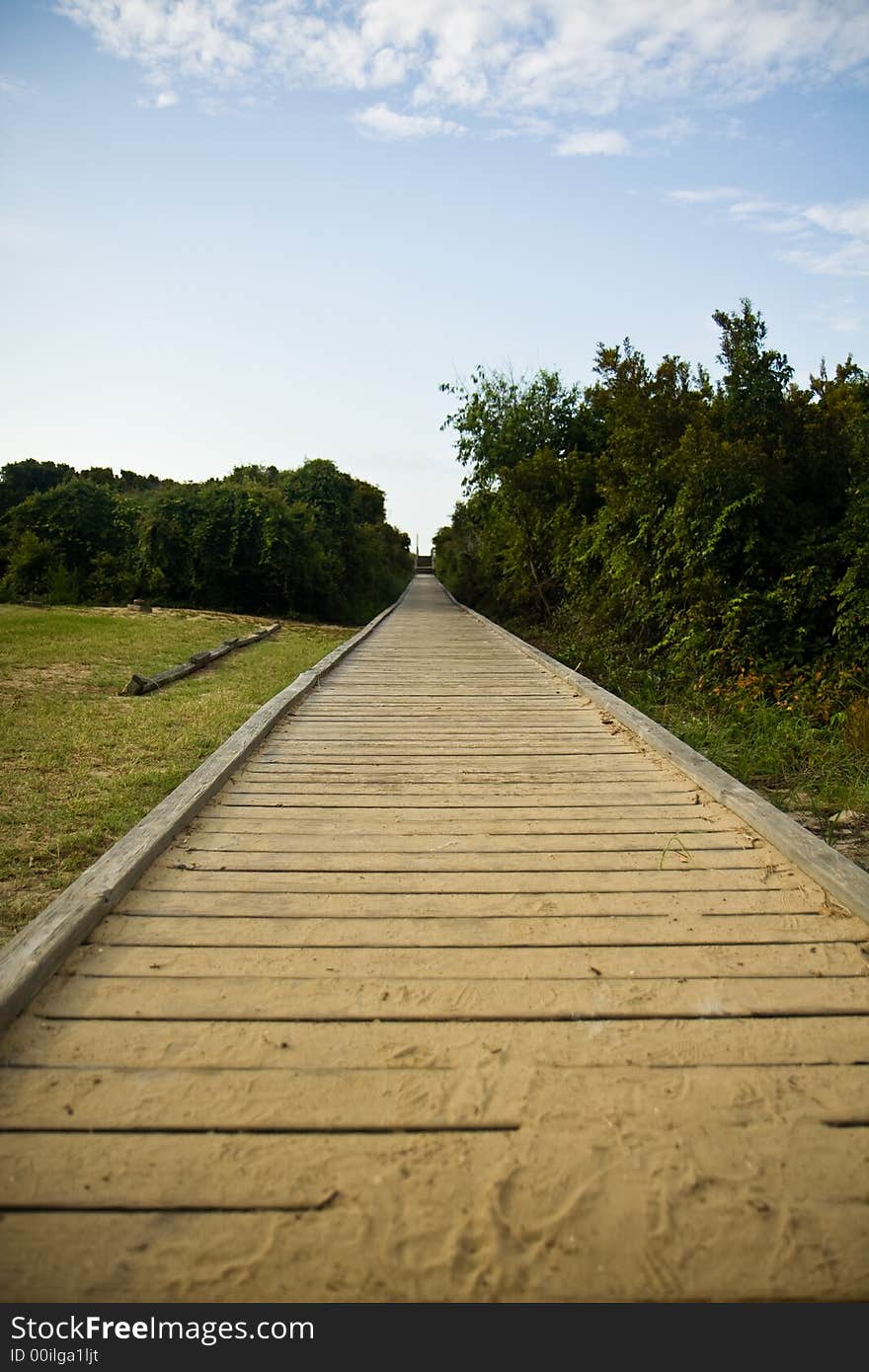 Sandy Wooden Boardwalk Leading