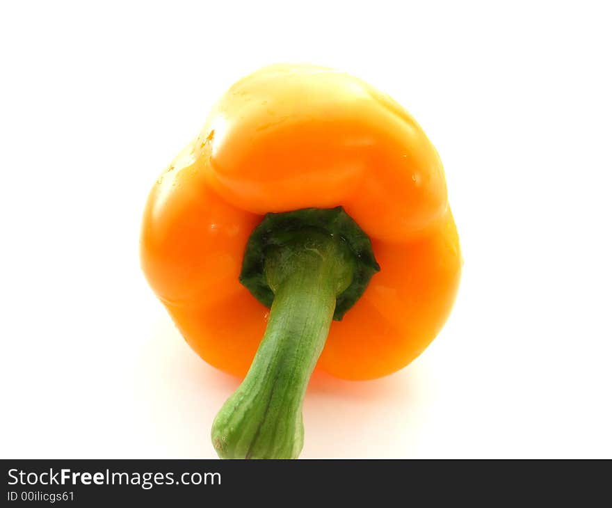 Sweet ripe orange pepper on white background