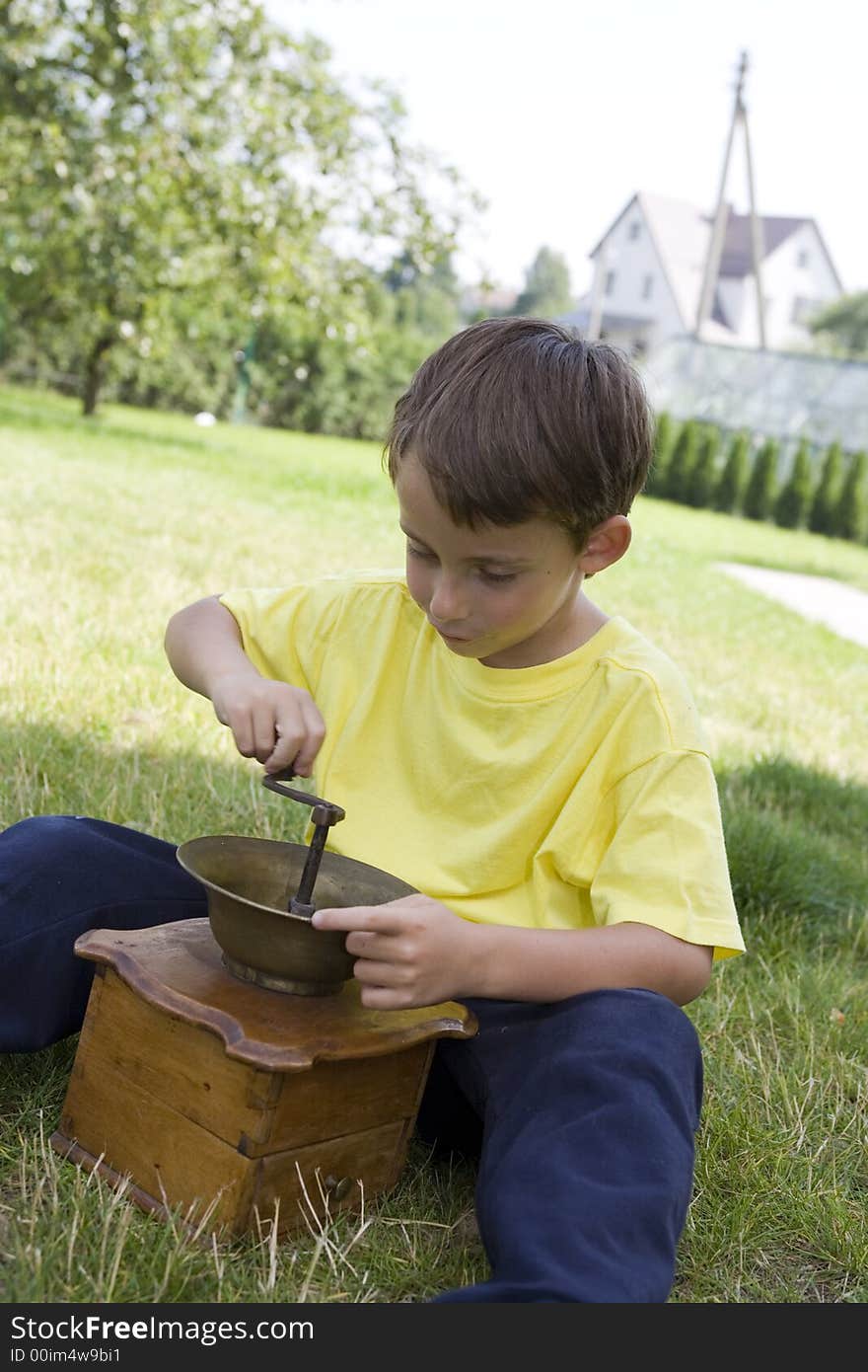 Boy and coffee mill