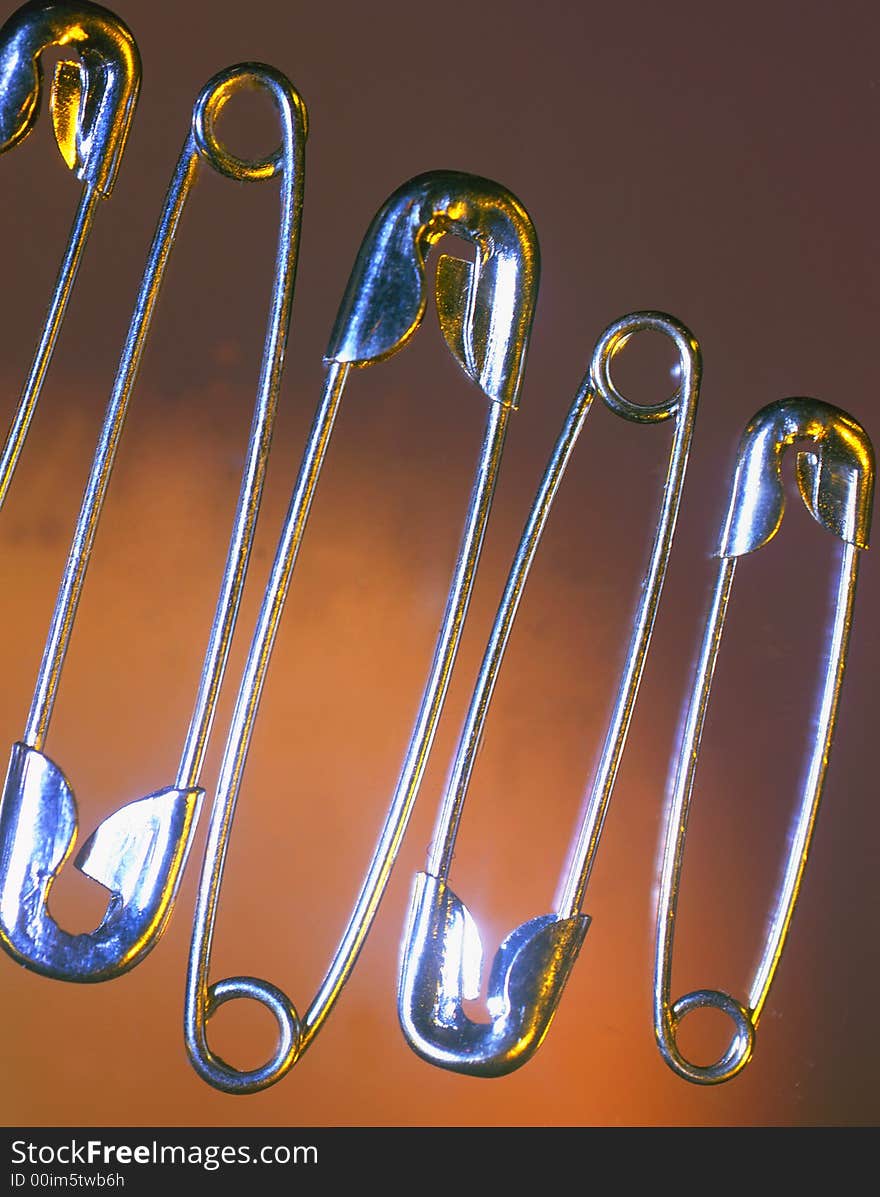 Silvery pins on a brown background