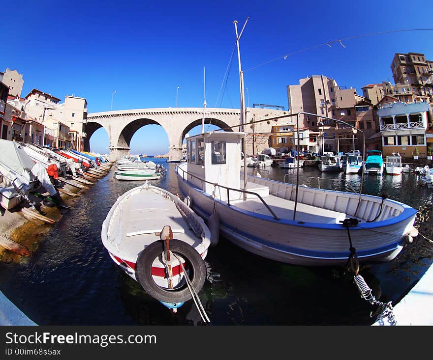 Bright contrast effect of boats in a small harbour in marseille, france. Bright contrast effect of boats in a small harbour in marseille, france