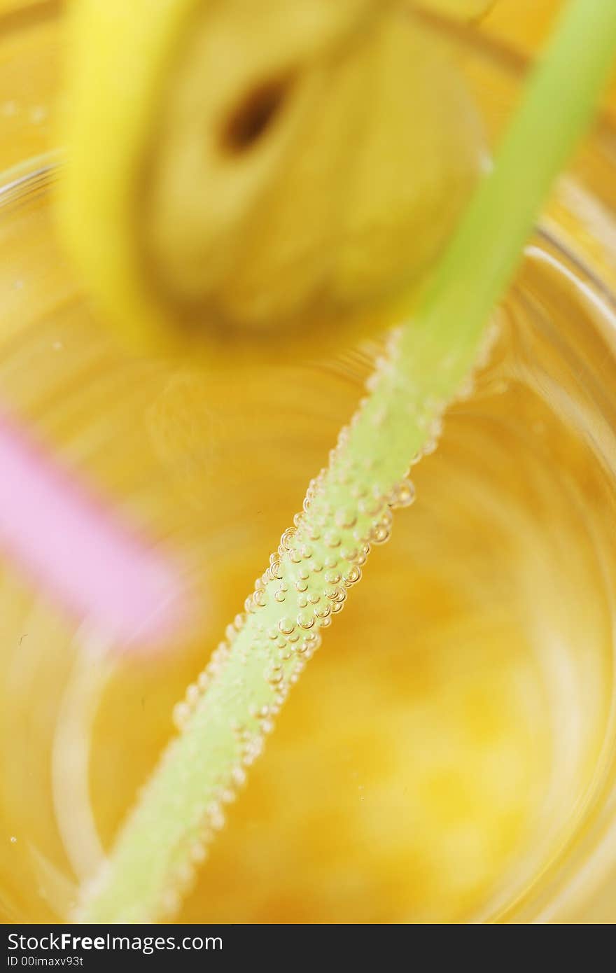 Water, sparkling, lemon, straw, glass. Water, sparkling, lemon, straw, glass