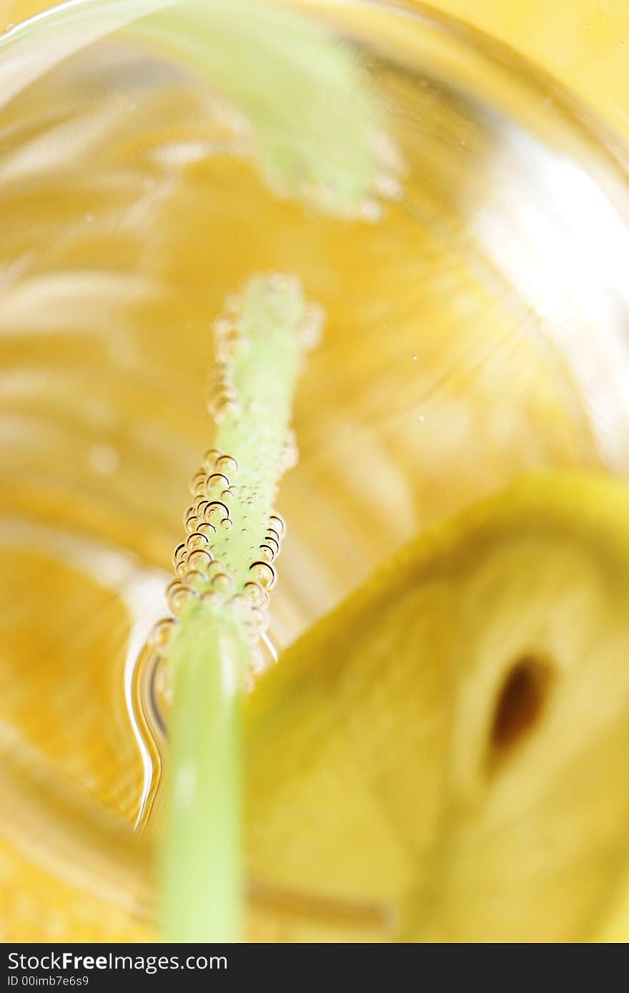 Water, sparkling, lemon, straw, glass. Water, sparkling, lemon, straw, glass