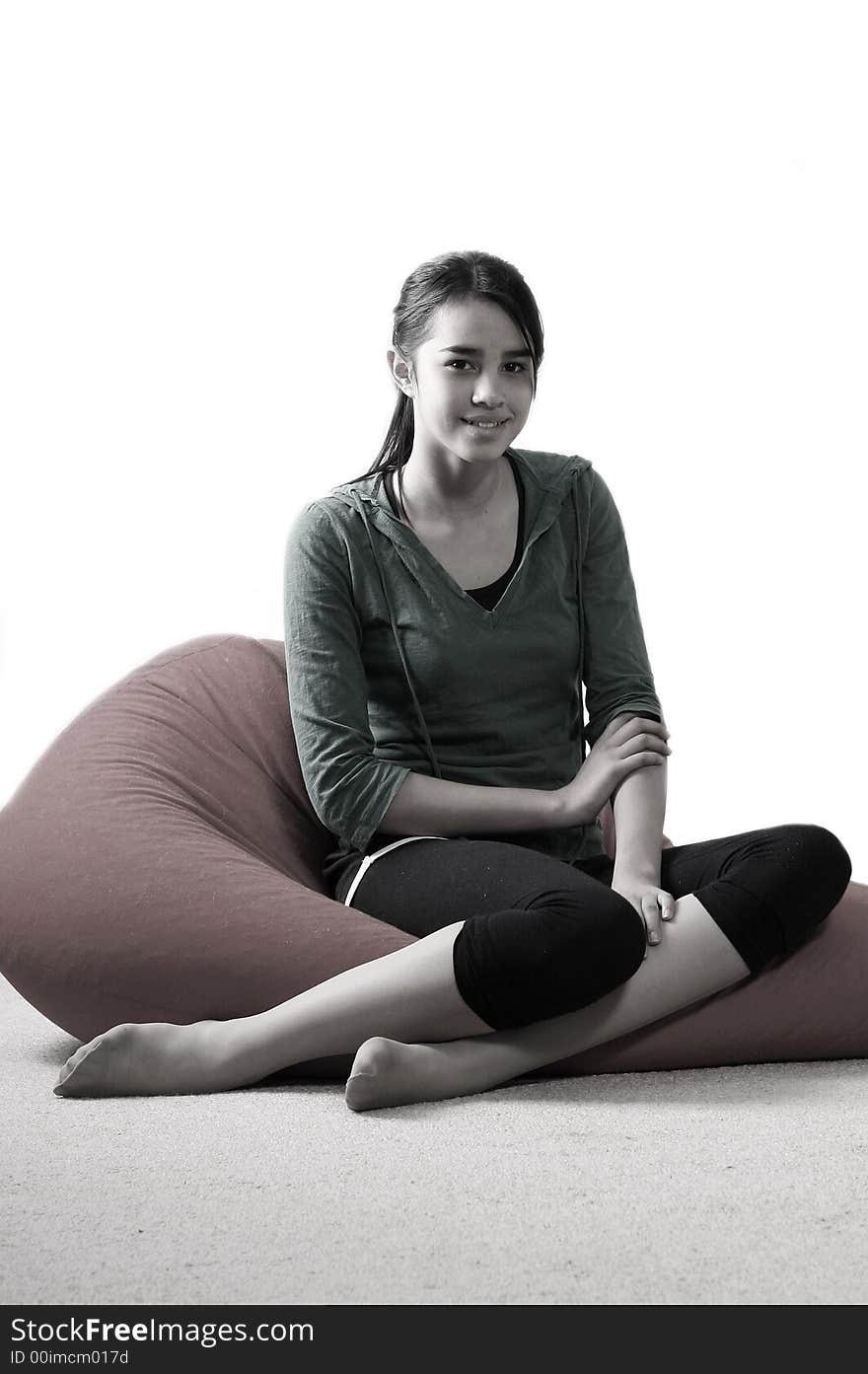 Young pretty women on red bean bag relaxing