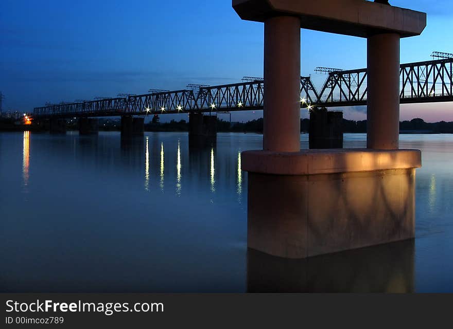 Night view on the bridge with illuminated light and reflection water