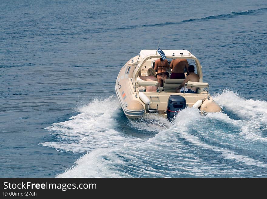 Group of people cruising on a small boat. Group of people cruising on a small boat