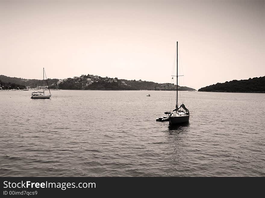 Calm sea view in greek island with two small boats