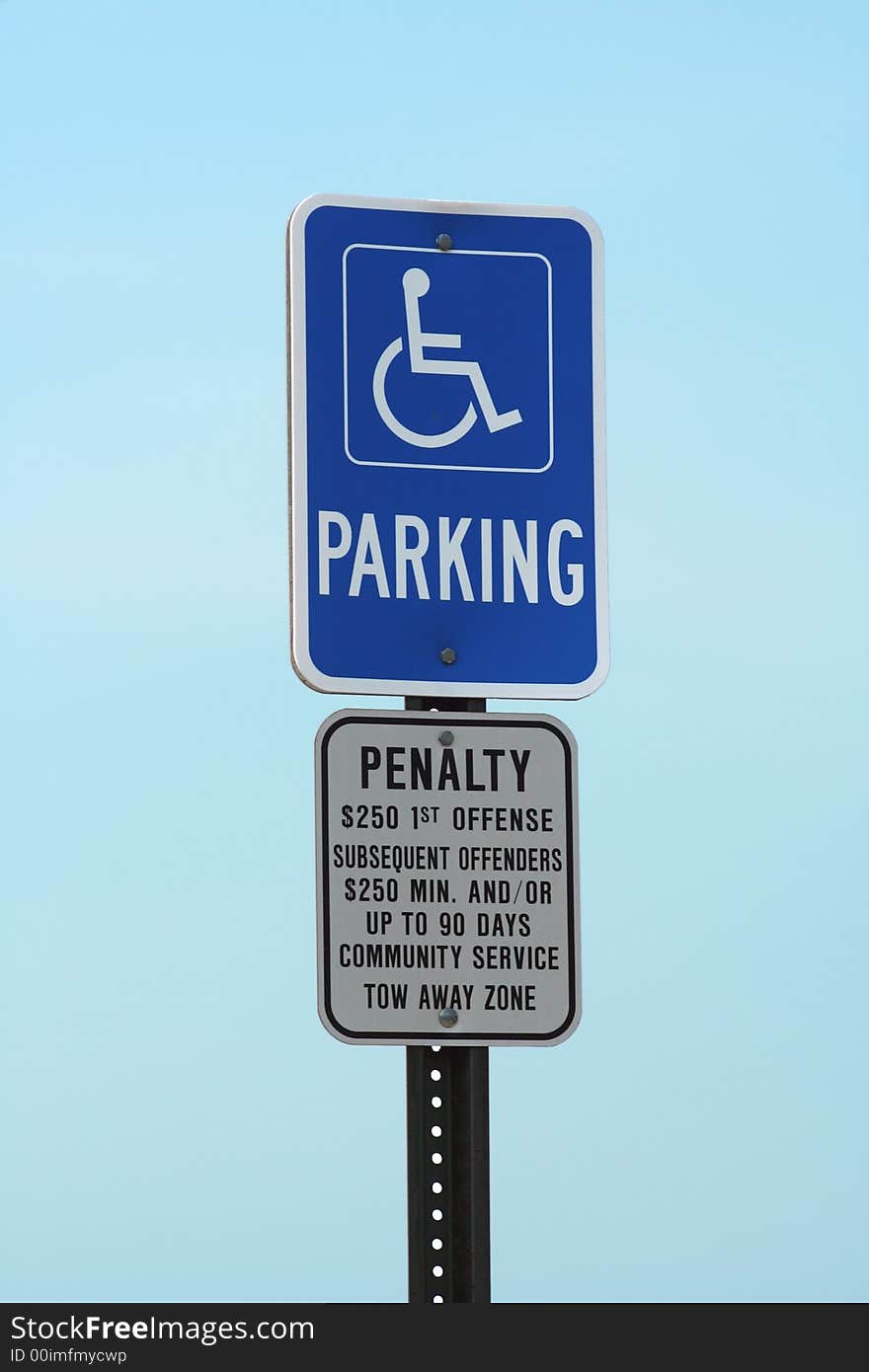 Handicapped Parking sign against a blue sky