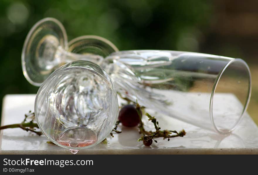 Wine glass down on a glass table