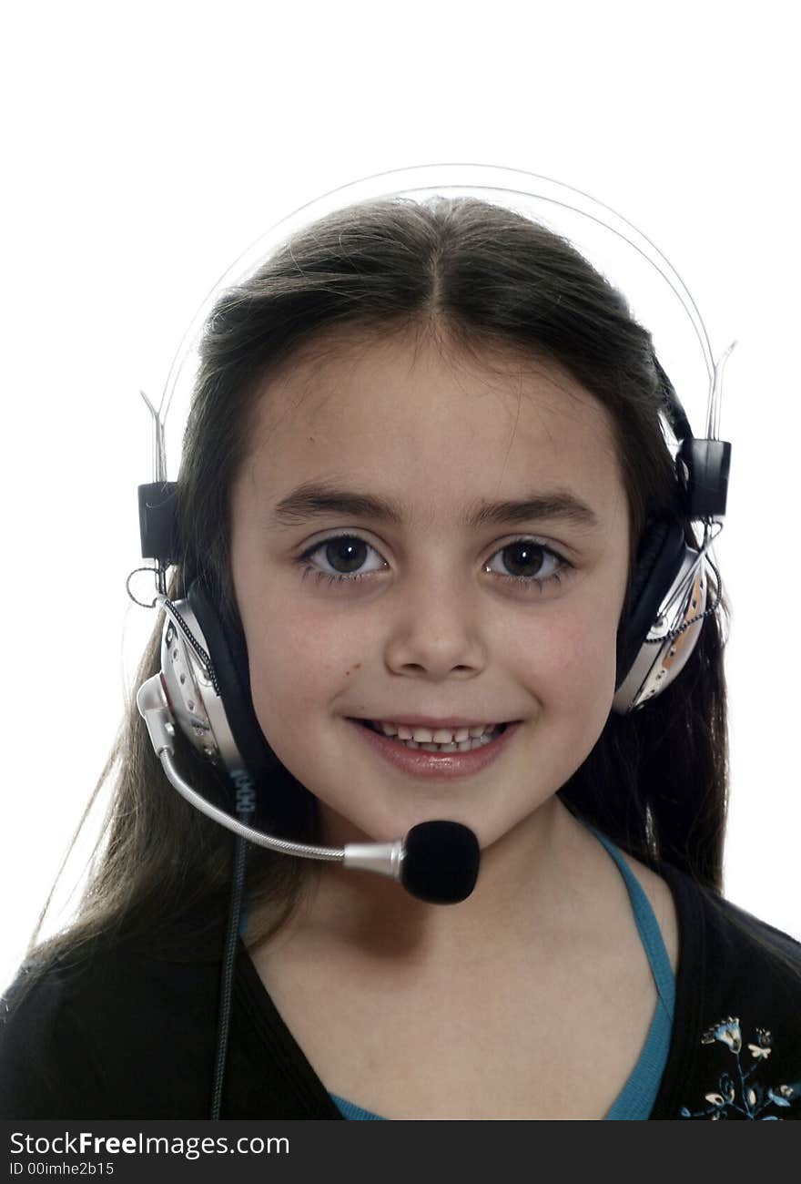 Young girl with headphones smiling at camera