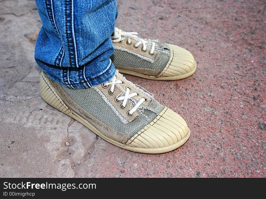 Modern trainers and asphalt texture