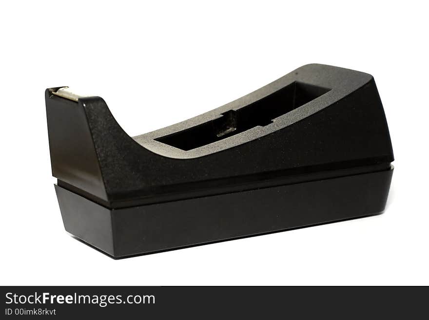 A black tape dispenser isolated over white background. A black tape dispenser isolated over white background.