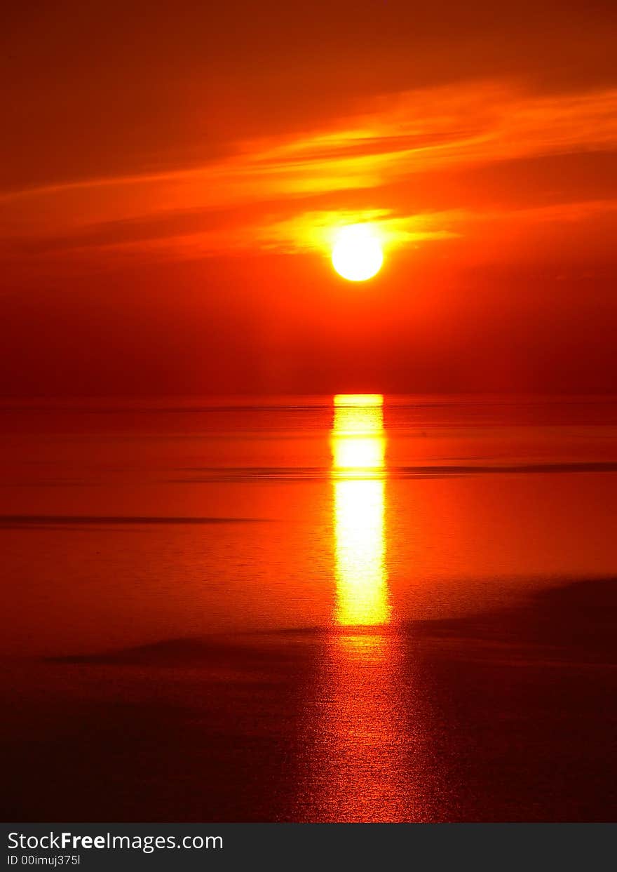 The sun rises early in the morning over lake Ontario. The sun rises early in the morning over lake Ontario.