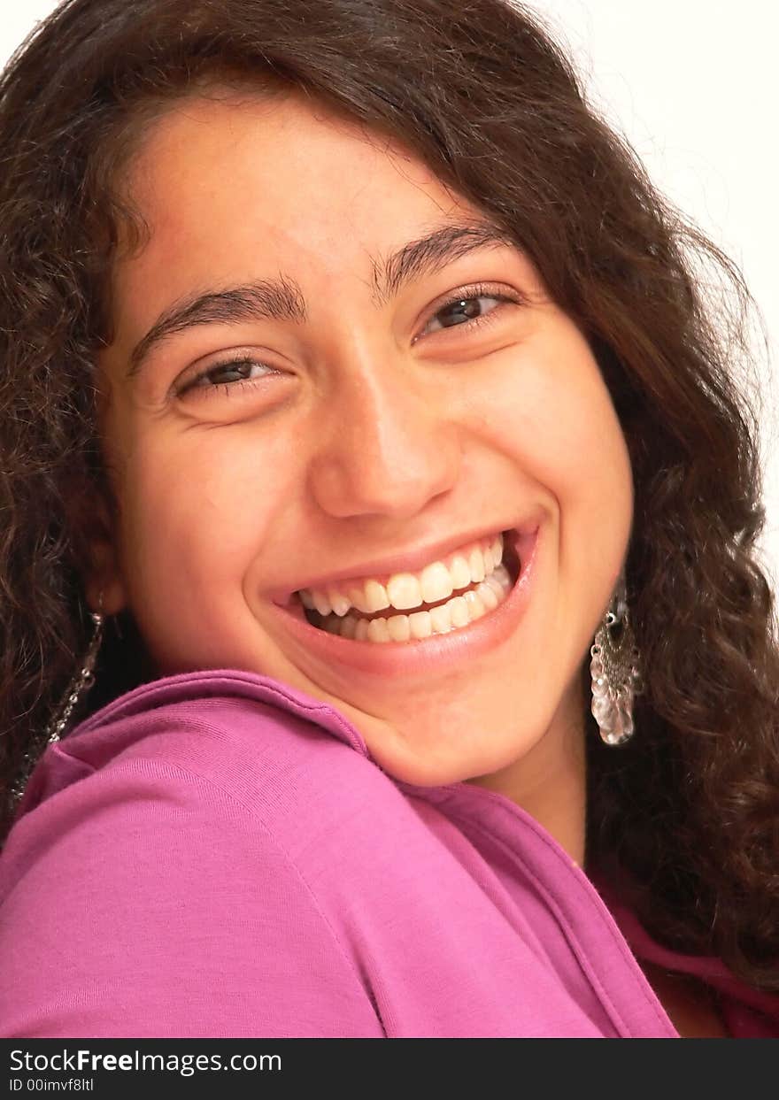 A close-up shot of the face of a pretty young girl with long dark hair
for white background an nice smiling. A close-up shot of the face of a pretty young girl with long dark hair
for white background an nice smiling.