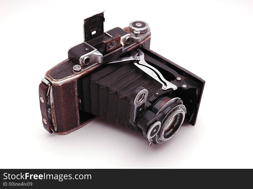 Old roll-film camera isolated on white