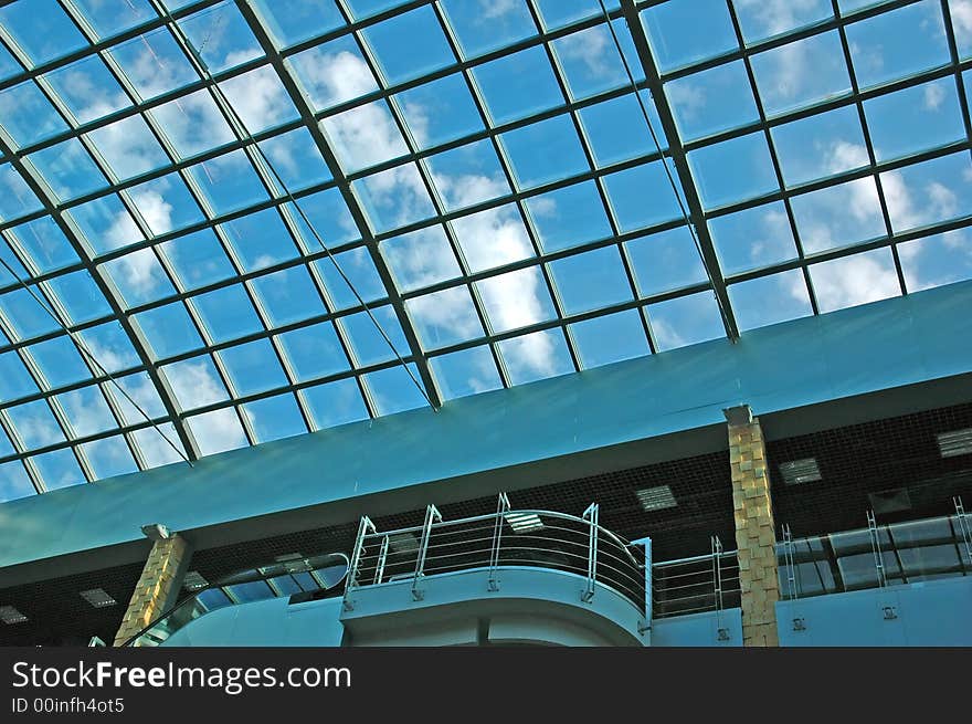 Modern trade centre with a sky reflection