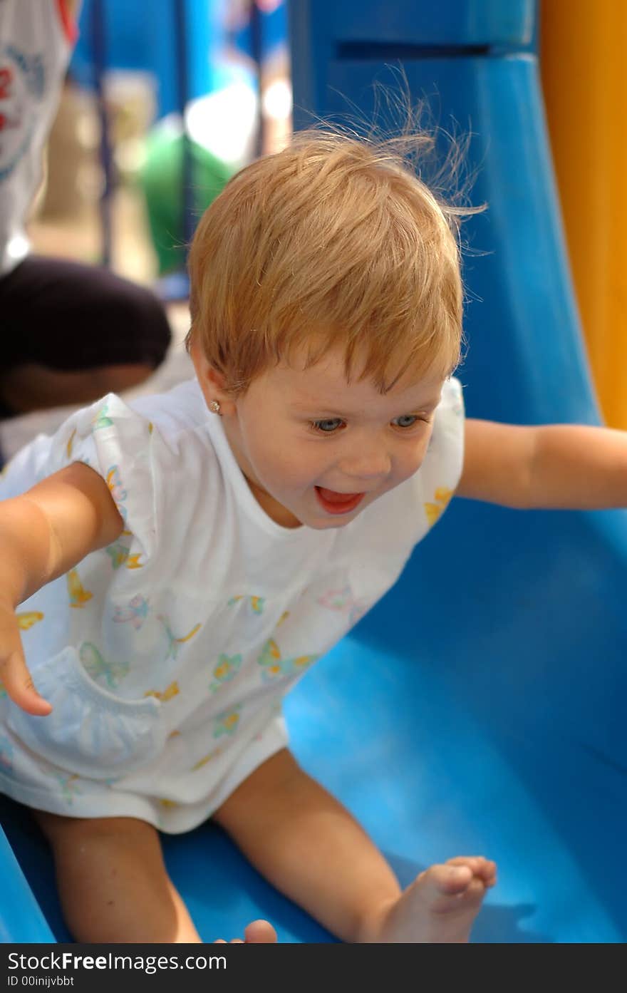 Fun girl at outdoors playground