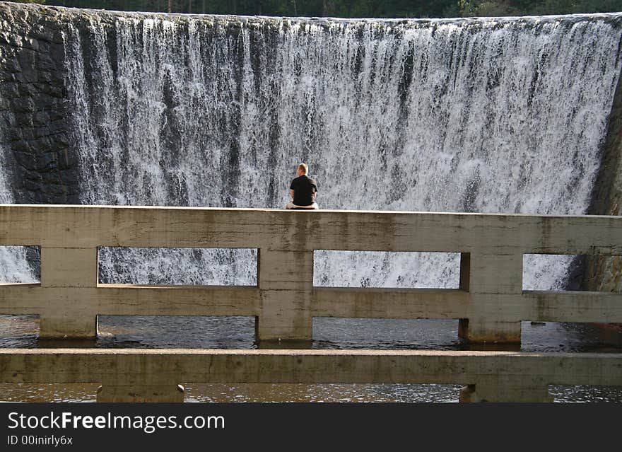 Alone man and beautifull waterfall