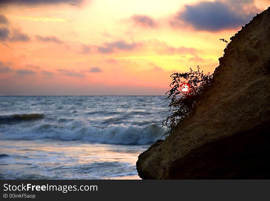 Cloudy sunrise over sea bay