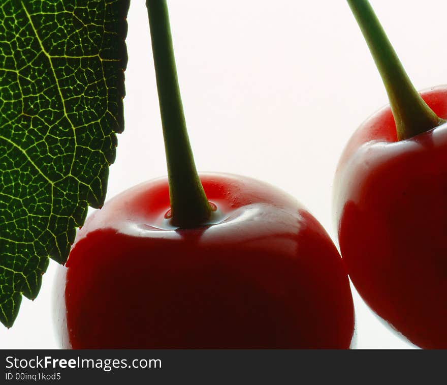 Red cherry costing on a white background