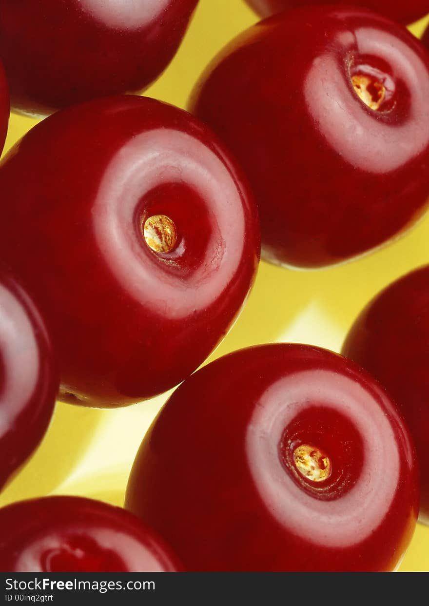 Red cherry costin} on a yellow background