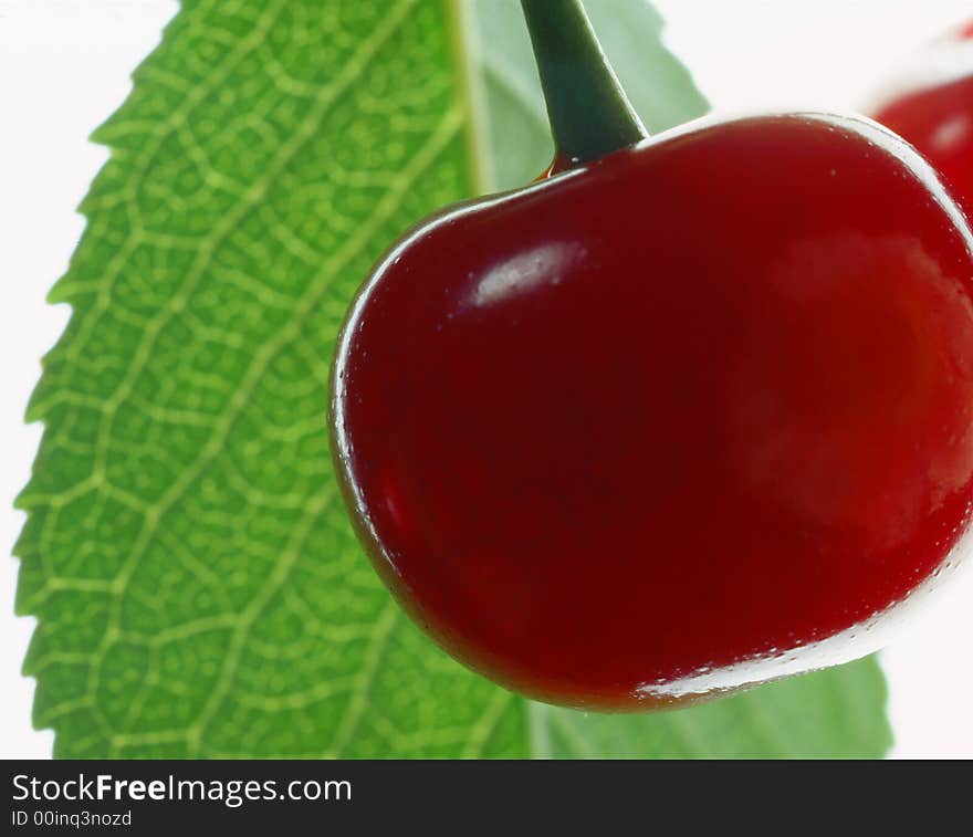 Red cherry costing on a white background