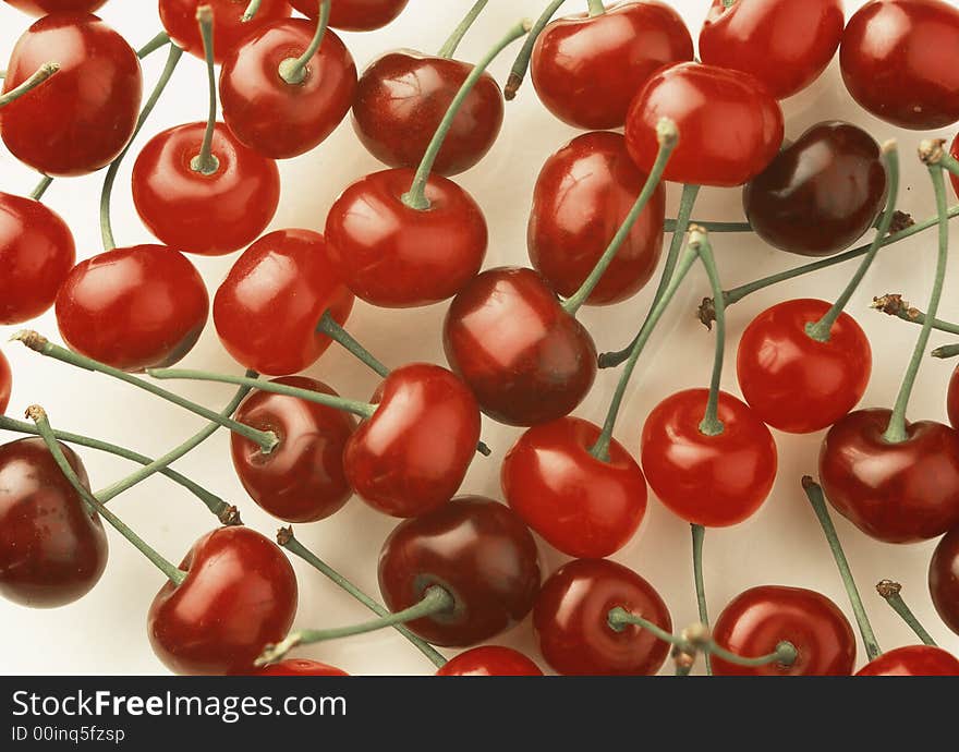 Red cherry costing on a white background